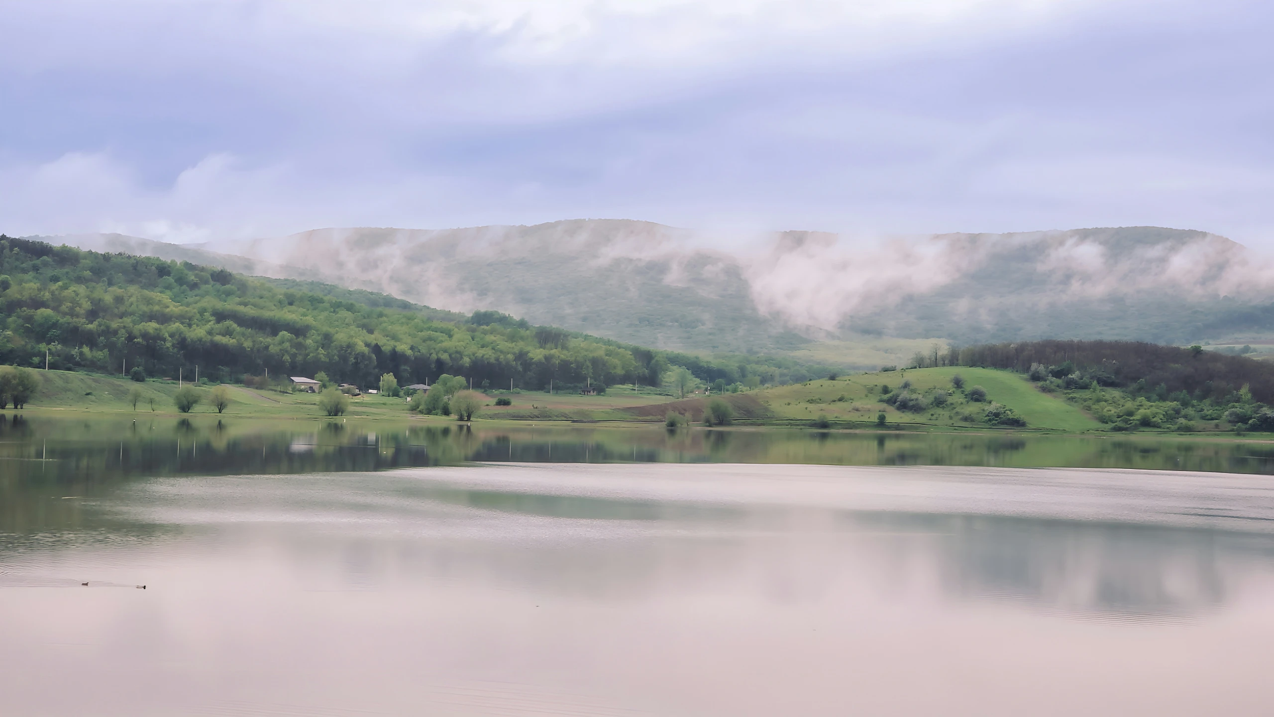 a very scenic looking mountain lake, and clouds above