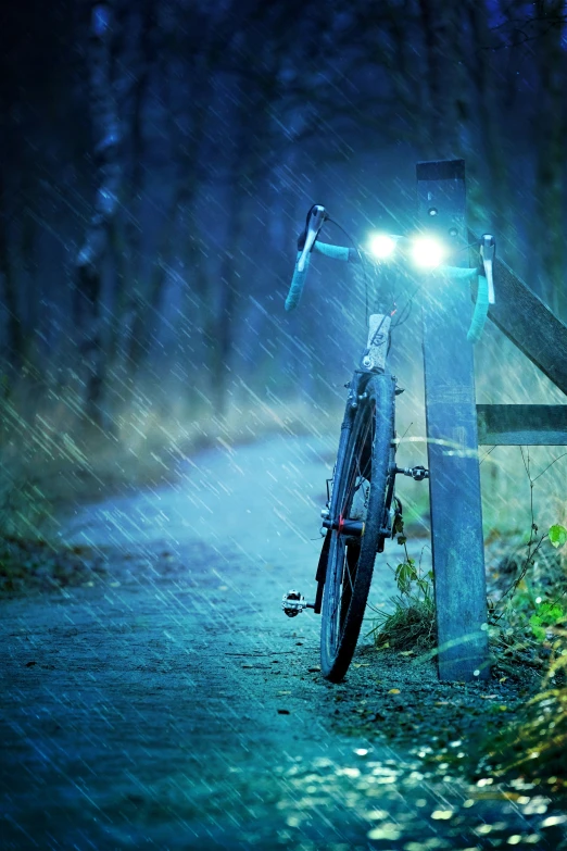 a bike has been locked to a post in the rain