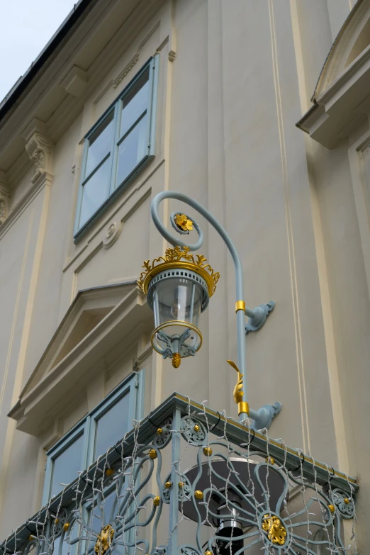 there is a sign for a street light that is painted yellow