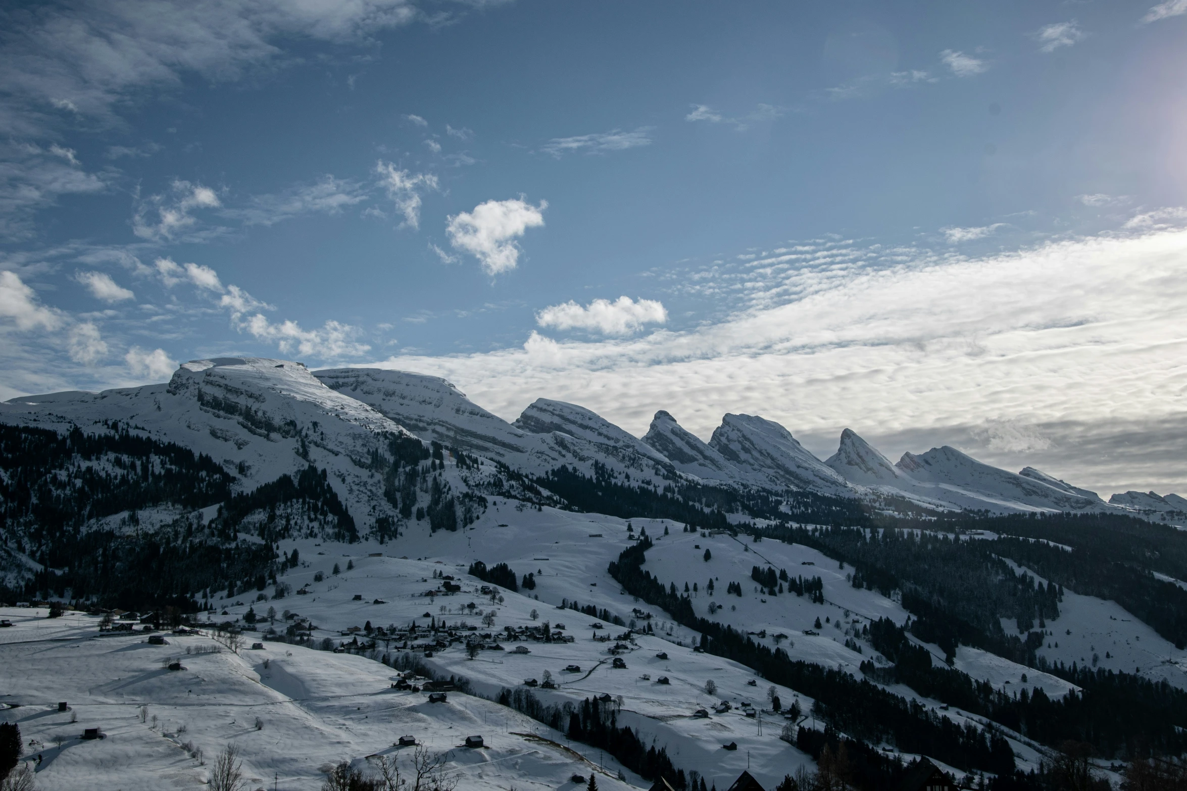 a couple of hills that have snow on them