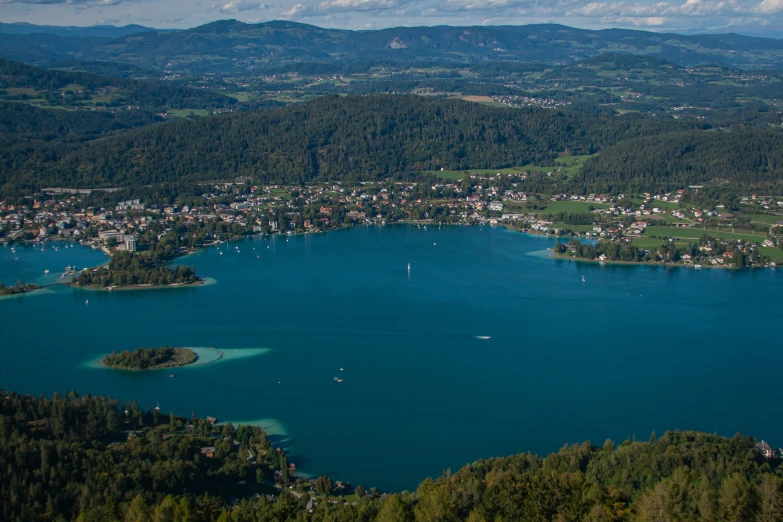 a bird's - eye view of a bay surrounded by wooded hills