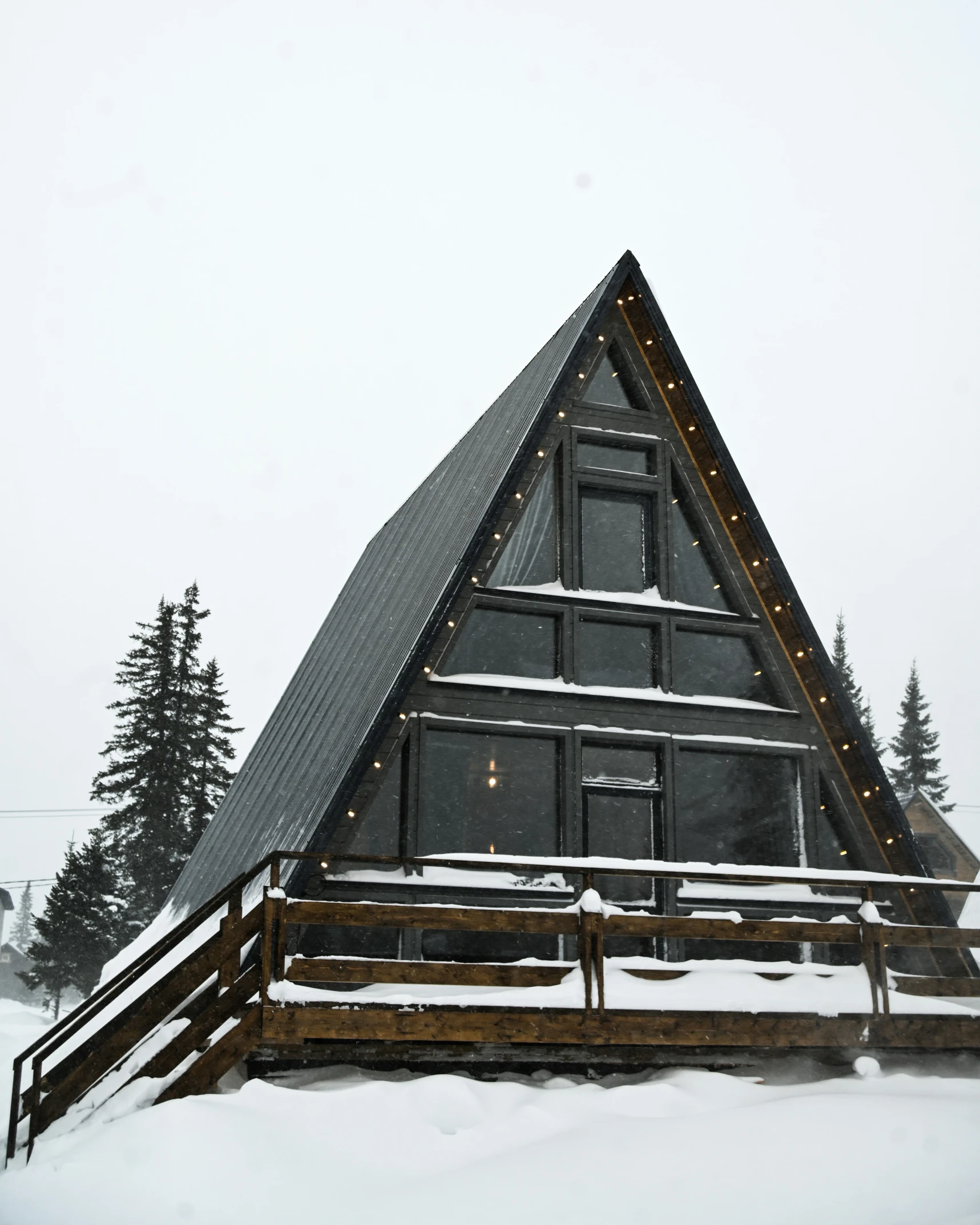 a building with lights on it and covered in snow