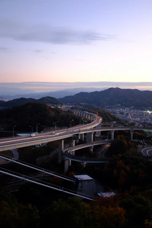 an overhead view of cars driving on highway