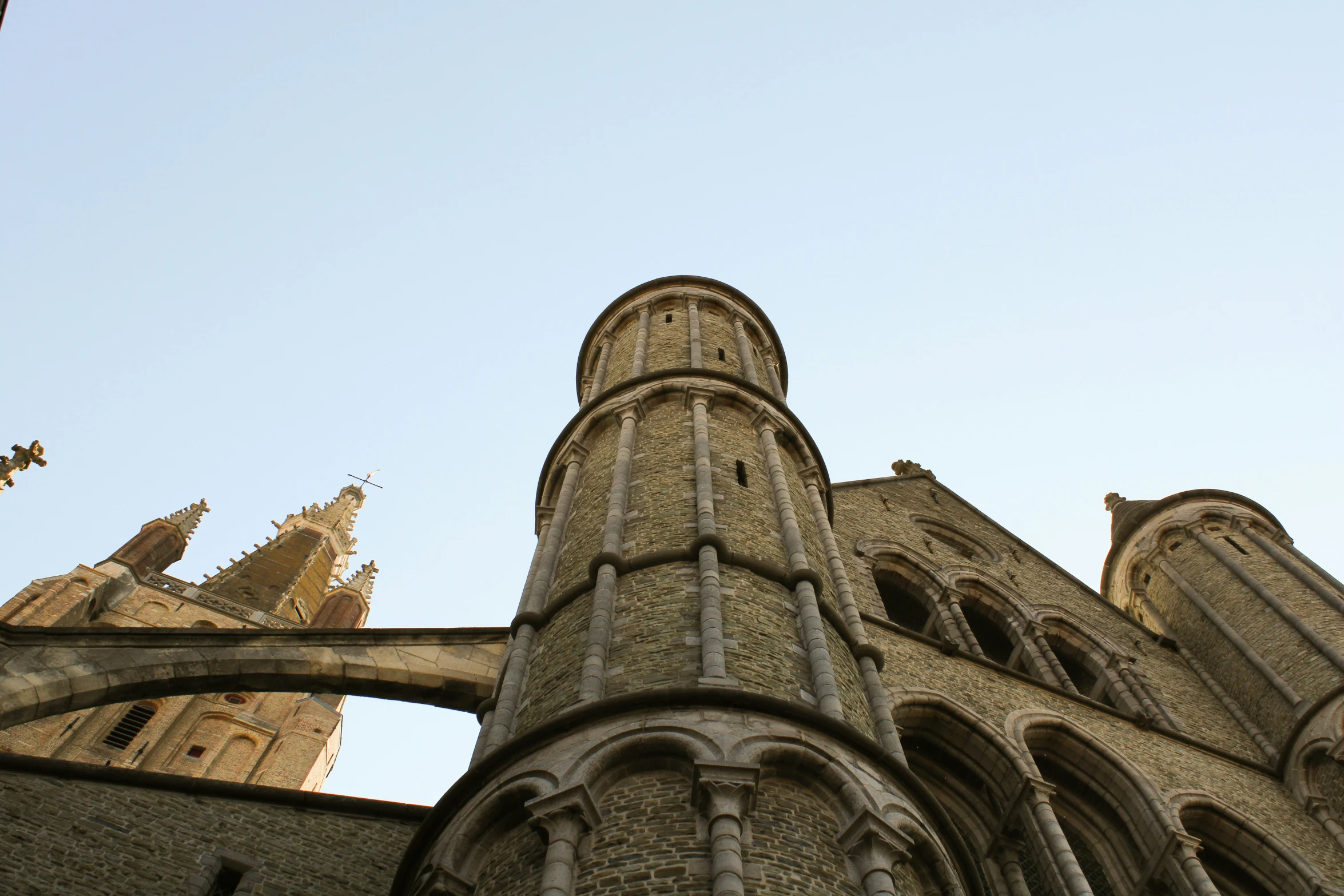 a church with stone structures and windows