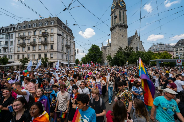 people in a big crowded street and some buildings