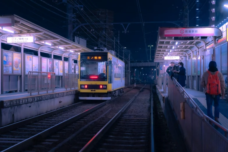 a yellow train is pulling into the station