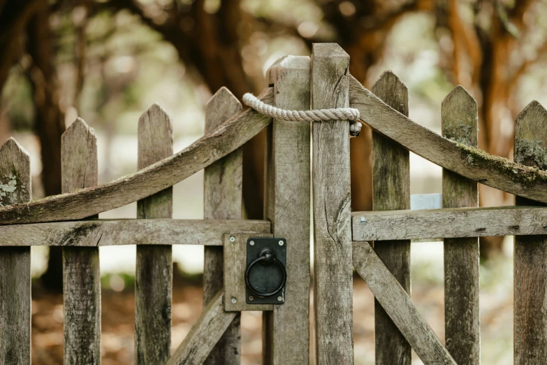 a close up view of a wood fence with an old metal on