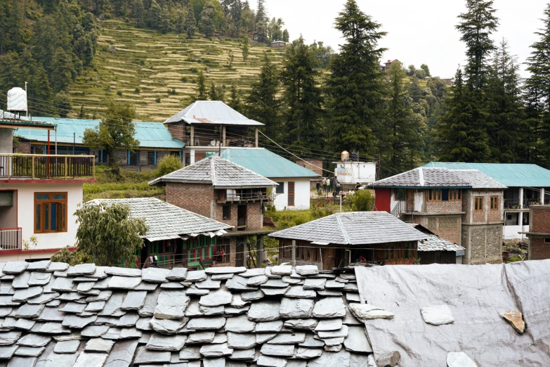 houses on a hillside with rooftops and tiled roofs