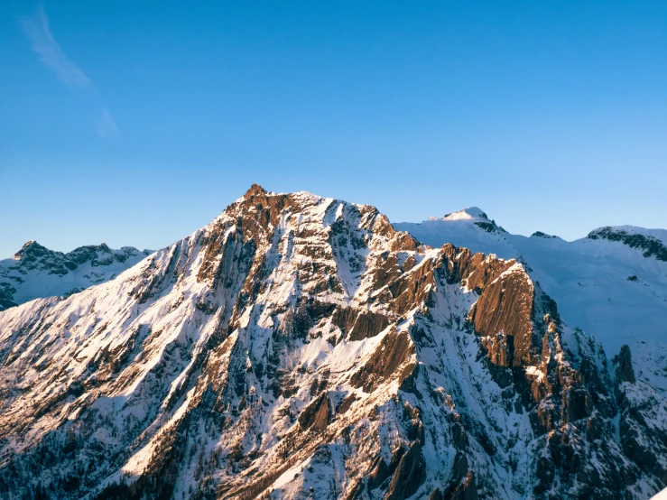 a very big mountain that is covered in snow