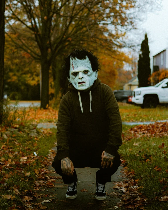 a person is standing outside in the leaves