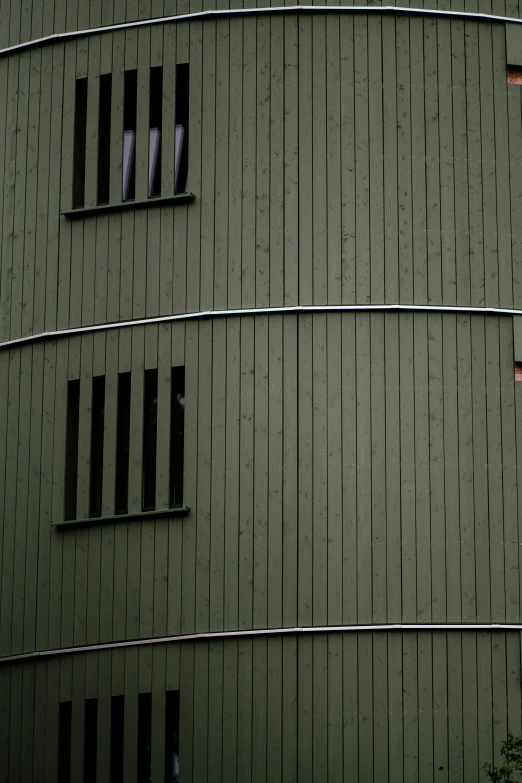 a building with broken windows in the middle