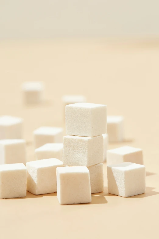 several white blocks of sugar sitting on top of a table