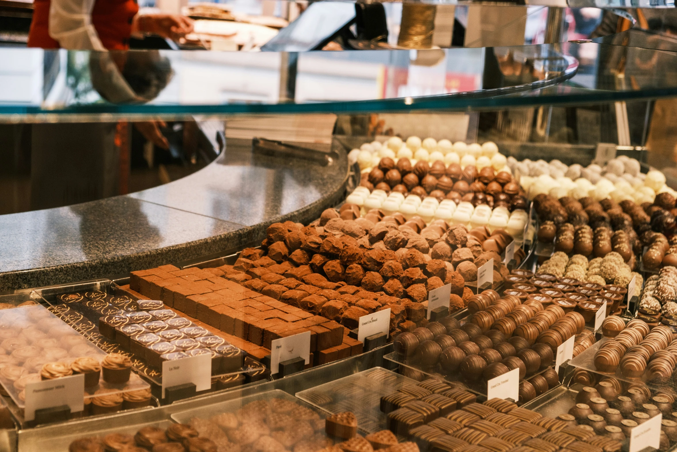 display case of assorted deserts in a food court