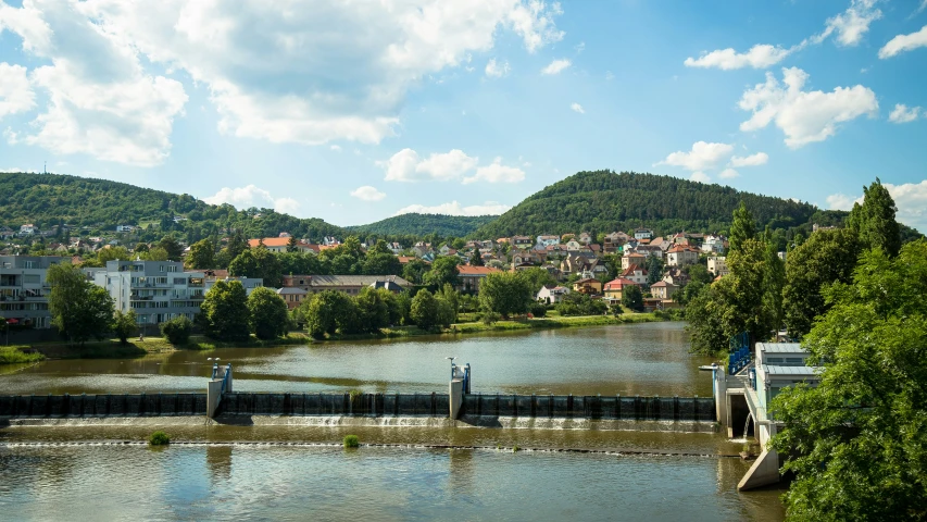 several buildings in a town and water on the side