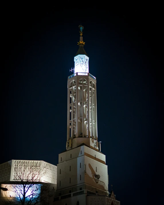 a large building at night with a clock tower