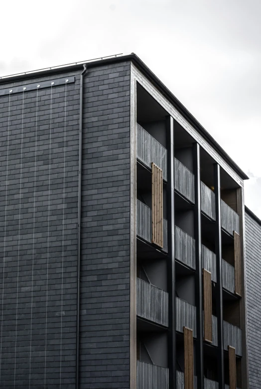 a building with some balconies and windows on top of it