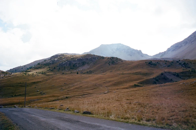 the hill behind the road is very high