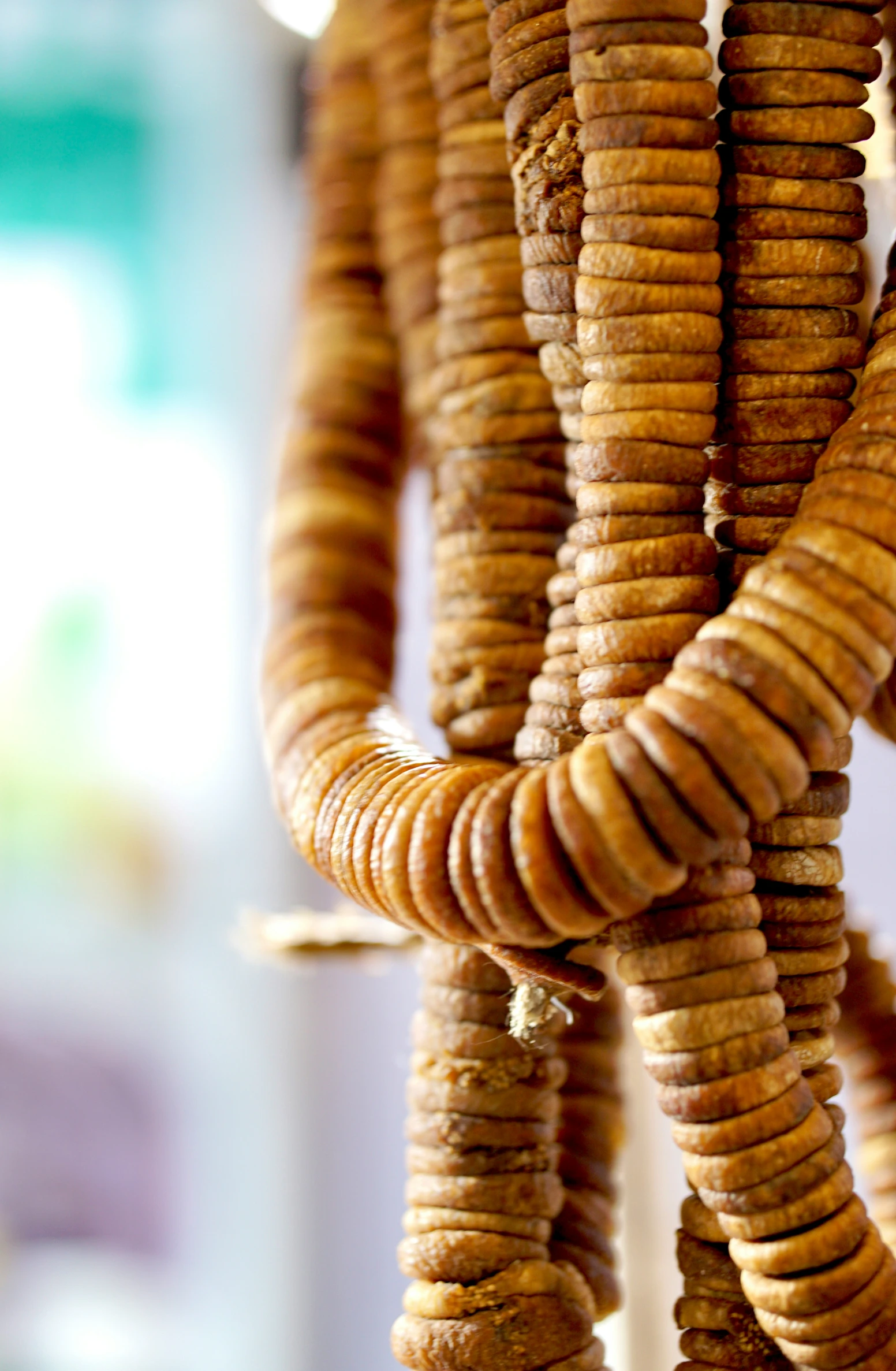 a bunch of macaroni sitting on a string