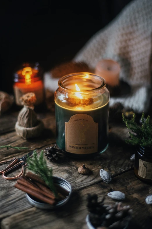 a candle on a table with some things on the table