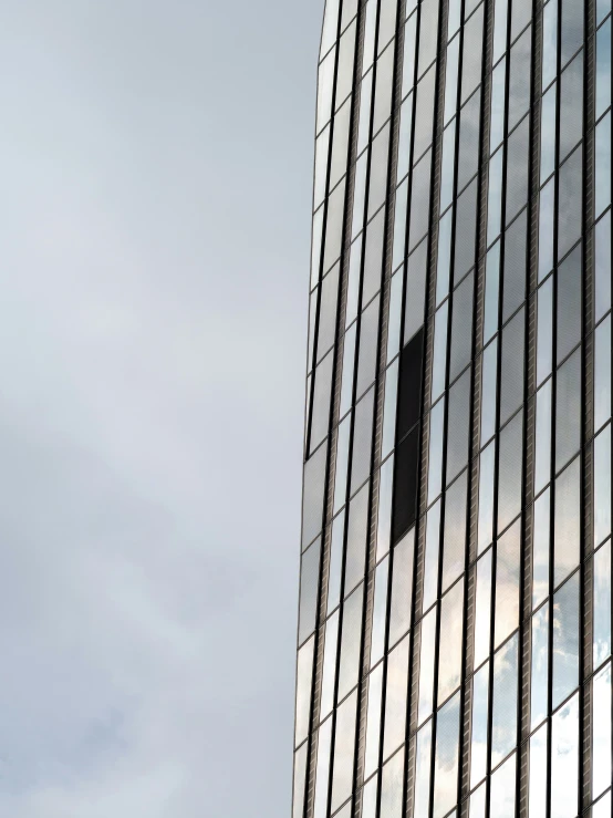 an airplane flying over the side of a building