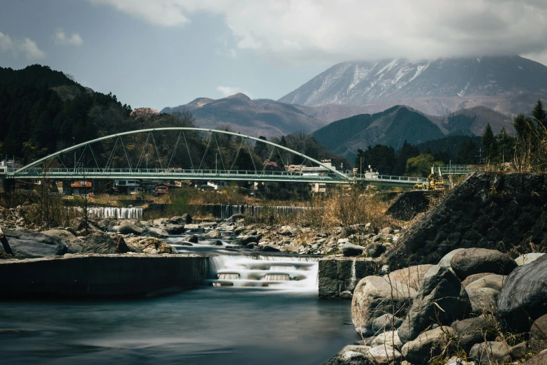 this is an image of a river flowing under a bridge