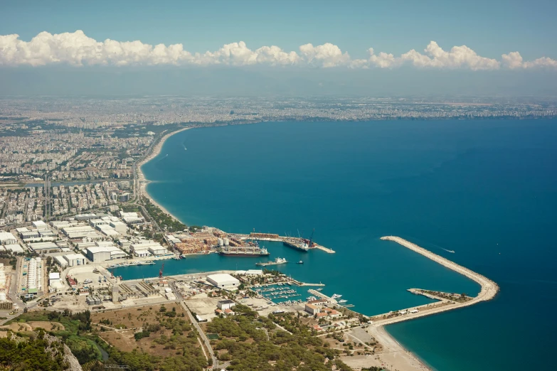an aerial view of the city and harbor of the ocean