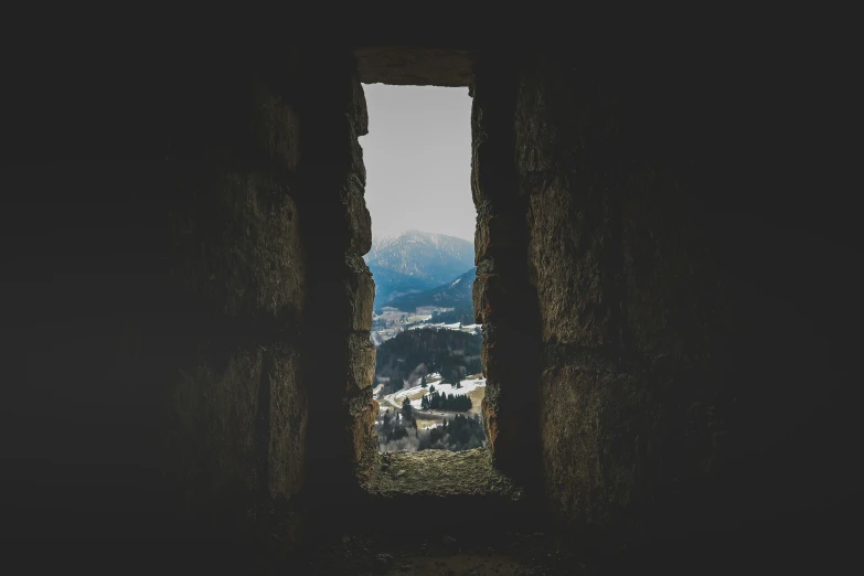 the window looks out onto a mountainous area