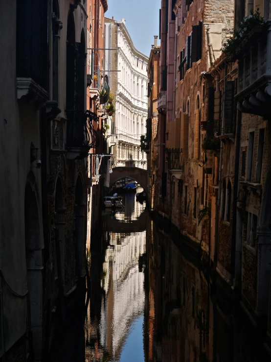 the narrow streets of old venice reflect light