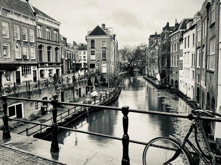 a canal and buildings are lined along the street