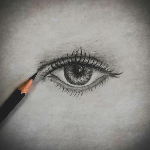 a pencil drawing of an eye with a large tear