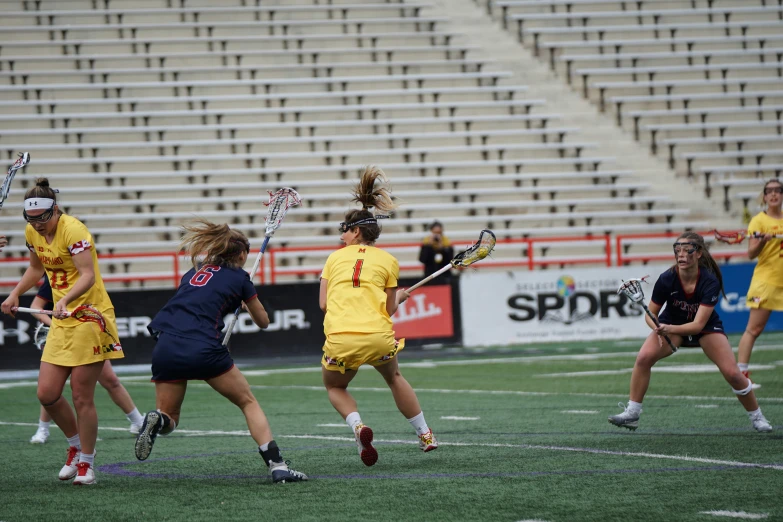 the lacrosse team is playing against each other on the field