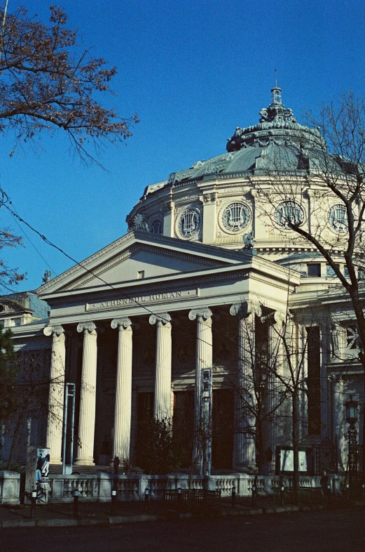 a building with large pillars with columns and a dome