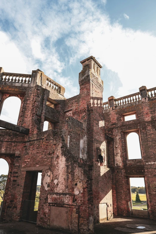 an old ruin with arches and a clock tower