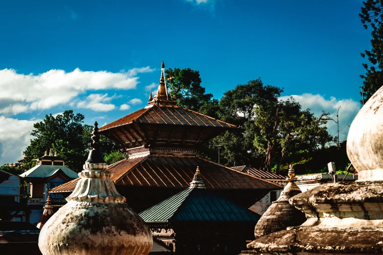 a group of urns in front of a building and sky