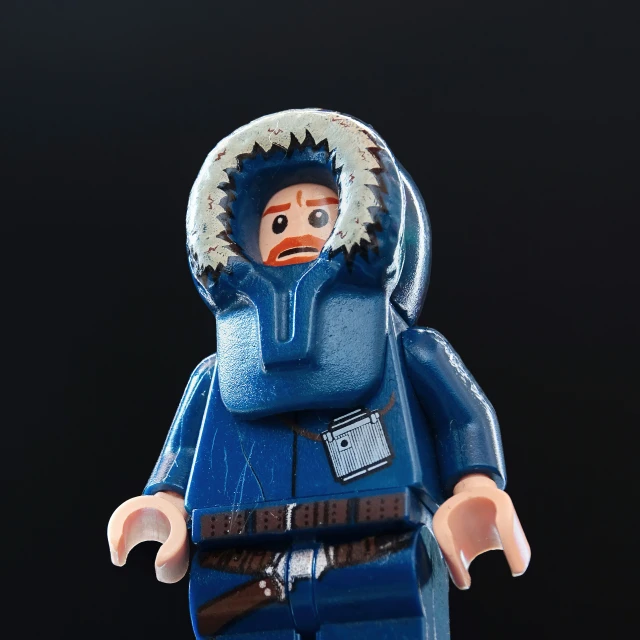 a lego person wearing blue clothes and with a large open mouth