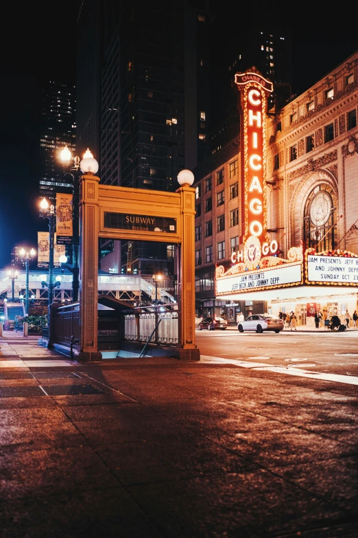 a city sidewalk with a clock tower and cars