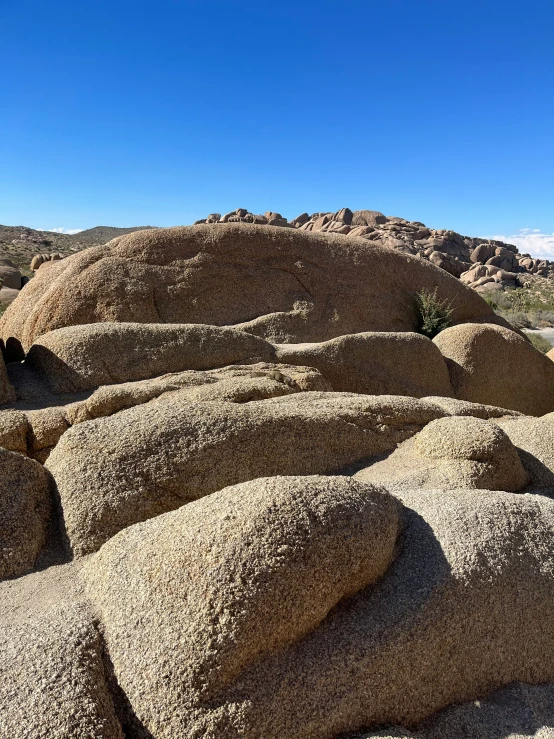 a picture of some big rocks by the water