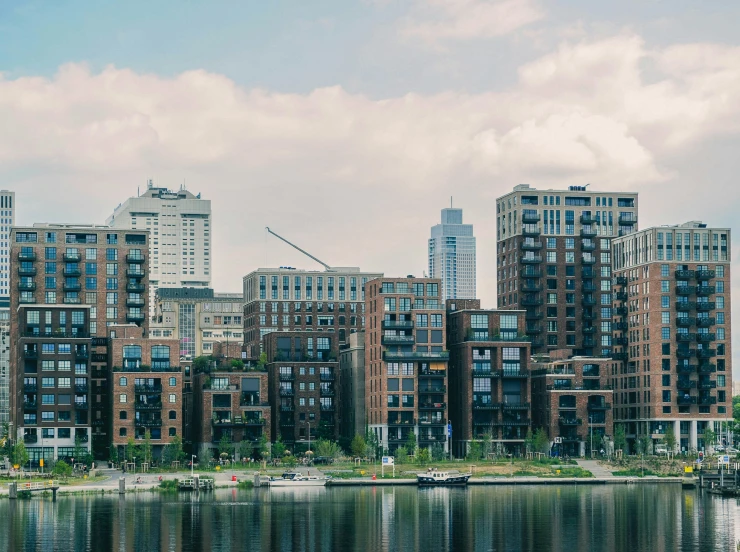 a large body of water next to tall buildings