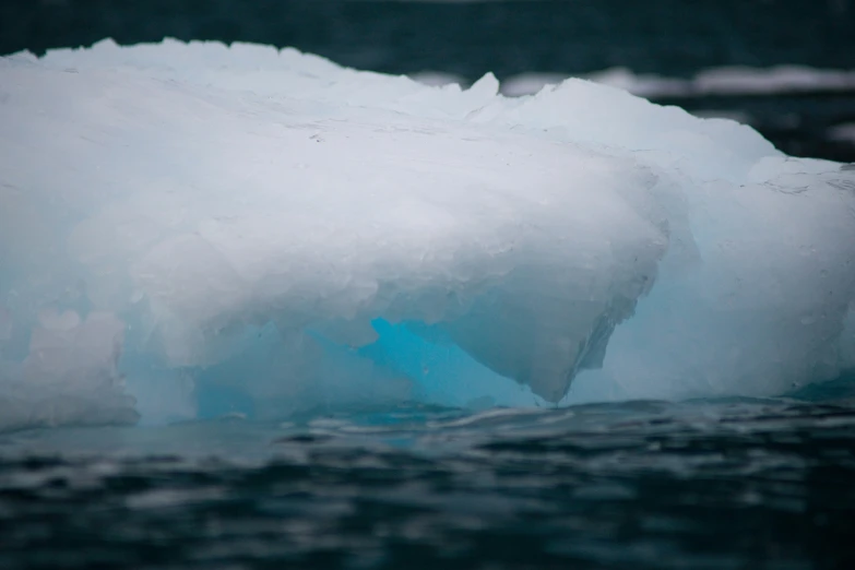 this picture shows an iceberg in the water