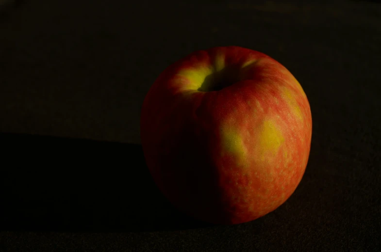 an apple sitting on top of a table