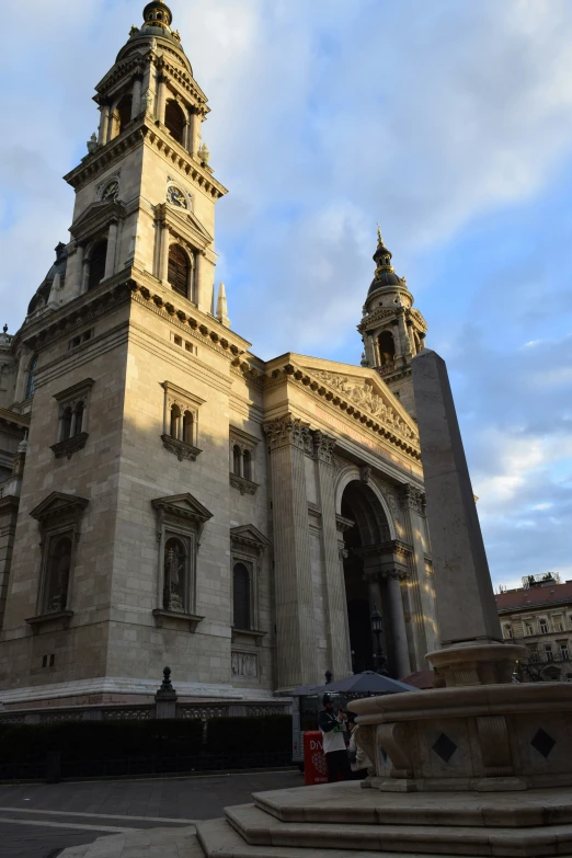 the very tall tower has many windows and a clock on it