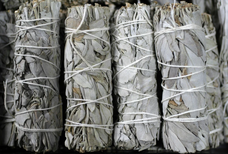 several large sticks wrapped in white paper