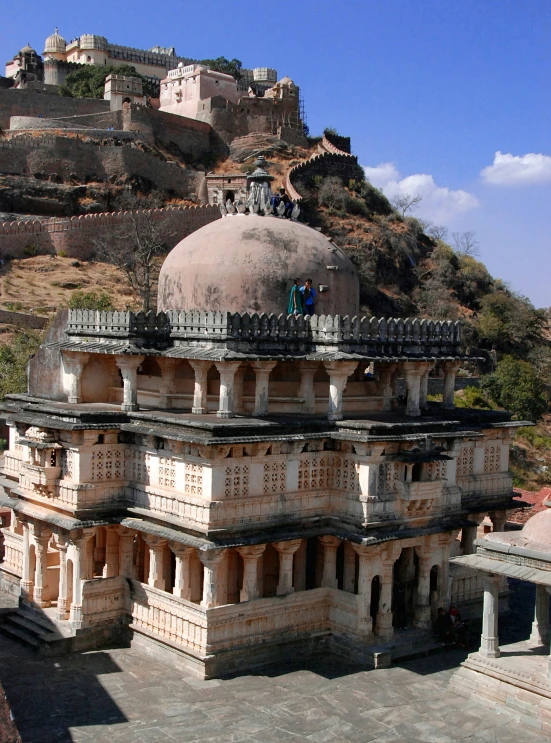 an old structure stands atop a mountain