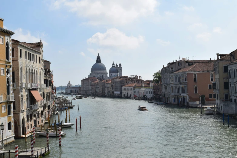 a view down a canal filled with water and old buildings