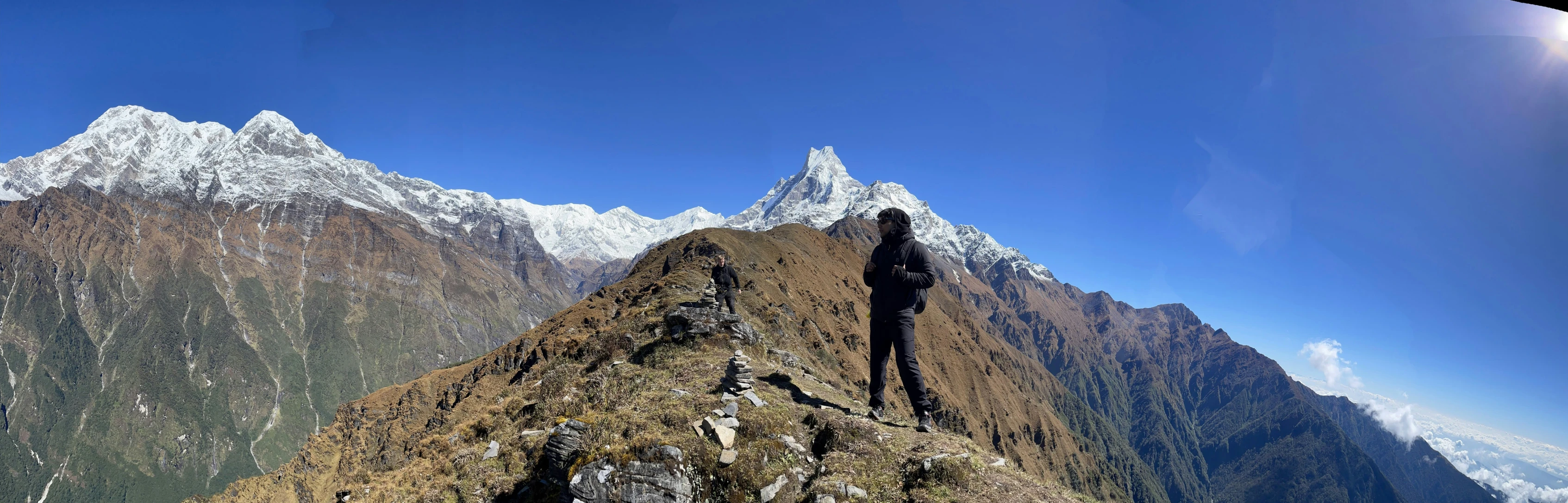 a lone hiker on the top of a steep hill