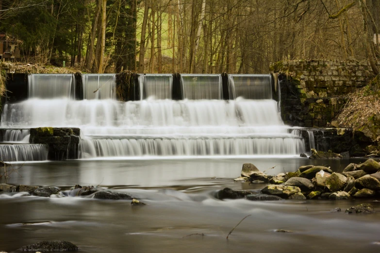 several waterfalls are shown in this artistic pograph