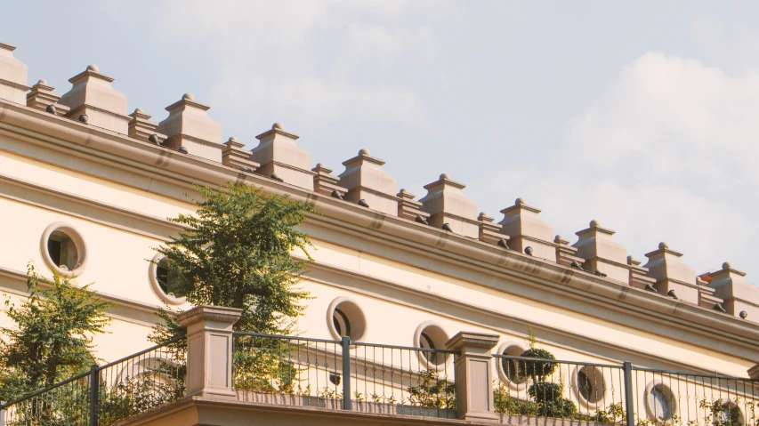 there are several round windows on top of this building