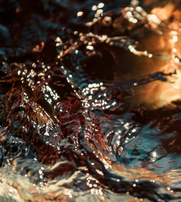 closeup of water moving on the surface and sunlight shining