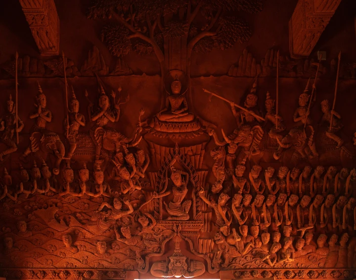 a wall painting in a temple decorated with figures and symbols