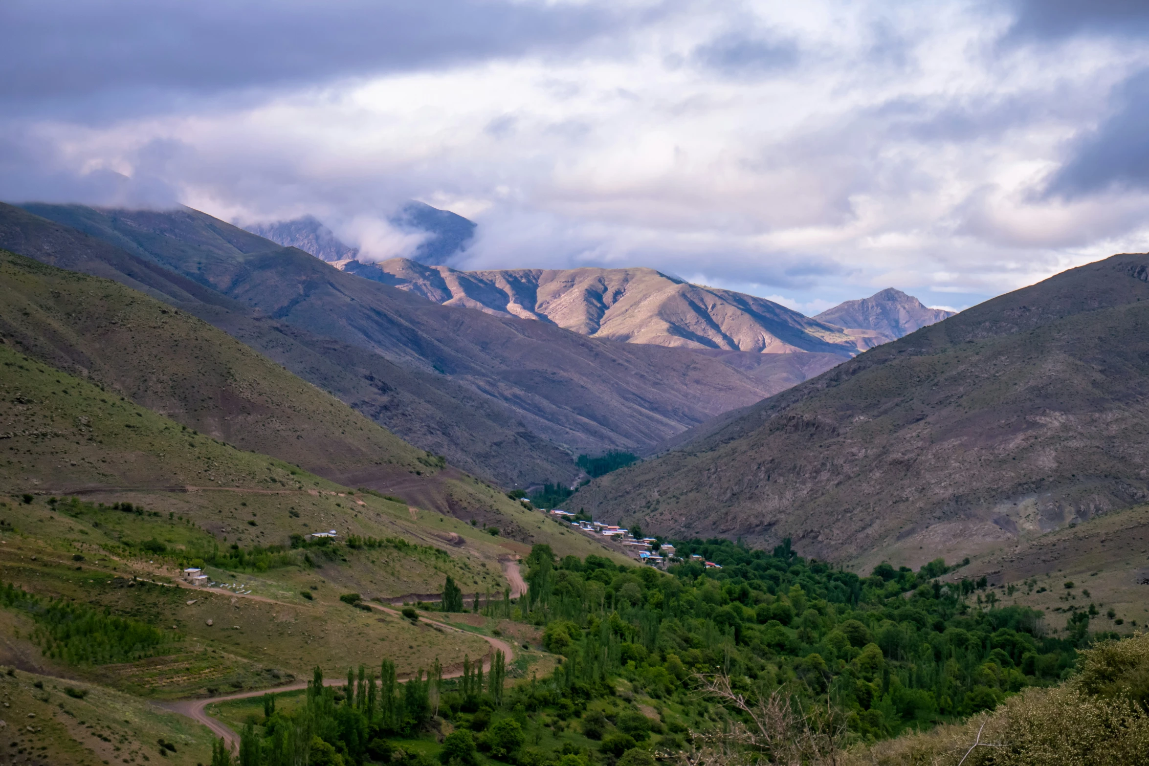 the beautiful valley is surrounded by a mountain range